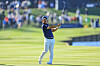 Tom Kim, also known as Kim Joo-hyung, plays his second shot on the 18th hole during the completion of the weather-delayed second round of The Players Championship on The Players Stadium Course at TPC Sawgrass on March 11 in Ponte Vedra Beach, Florida.  [GETTY IMAGES]