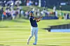 Tom Kim, also known as Kim Joo-hyung, plays his second shot on the 18th hole during the completion of the weather-delayed second round of The Players Championship on The Players Stadium Course at TPC Sawgrass on March 11 in Ponte Vedra Beach, Florida. [GETTY IMAGES]