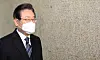 Democratic Party Chairman Lee Jae-myung makes a brief appearance at the National Assembly on March 2. [YONHAP]