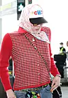 G-Dragon arrives at Incheon International Airport in Tesla Cybertruck