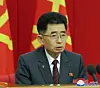 A North Korean official is seen wearing a pin featuring the portrait of North Korean leader Kim Jong-un in a photo carried by the North’s official Korean Central News Agency on Sunday. [YONHAP]