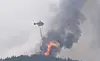 A helicopter on Monday continues to extinguish a fire that broke out in Hongseong County, South Chungcheong, on Sunday. [YONHAP]