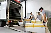 Important cultural assets get unloaded at the new Kansong Art Museum in Daegu on July 2. [KANSONG ART MUSEUM]