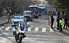 Buses carrying inmates leaving for a newly built detention center in Dalseong County, Daegu, while being escorted by police on Tuesday. [NEWS1]