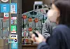 A street shop in Myeong-dong, a popular tourist destination in Jung District, central Seoul, is seen with instructions for making QR payments on its walls on Monday. As foreign tourists from Asean countries flock to Korea, many are requesting payments using QR codes instead of credit cards. The expansion of QR payment infrastructure is emerging as a hot topic amid the sharp drop in the value of the won. [YONHAP]