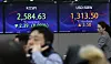 Screens in Hana Bank's trading room in central Seoul show stock and foreign exchange markets open on Friday. [YONHAP]