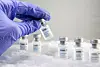 Woman holds a vial labelled ″COVID-19 Coronavirus Vaccine″ over dry ice in this illustration taken, December 5, 2020. [REUTERS/YONHAP]