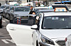 A woman rides a taxi near Seoul Station in central Seoul on Monday. [NEWS1]