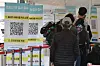 People stand in line to get tested for Covid-19 at a testing center in Seoul Station on Monday. [NEWS1]