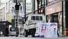 A worker takes down banners promoting the Korea Sale Festa at Myeongdong, central Seoul, in respect of those affected by the accident at Itaewon. [YONHAP]