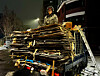 A man who collects paper and boxes poses for a photo. [JOONGANG ILBO]