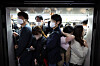 Passengers squeeze into a subway car at Gochon Station on Gimpo Gold Line on April 18. [YONHAP]
