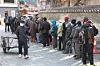 People wait in line for free meals at Tapgol Park in Nakwon-dong, Jongno District, central Seoul. [YONHAP]