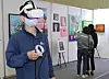 A visitor uses a virtual reality headset during a blockchain technology exhibition “NFT Busan 2021” in Bexco, Busan, on Nov. 4. [SONG BONG-GEUN]