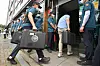 Police raid the office of Fighters for a Free North Korea, a civic group run by North Korean defectors resettled in the South, in Gangnam District, southern Seoul, on Friday. [YONHAP]