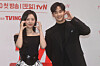 Actors Kim Soo-hyun, right, and Kim Ji-won take a picture during a press conference for 'Queen of Tears' on Thursday. [YONHAP]