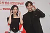 Actors Kim Soo-hyun, right, and Kim Ji-won take a picture during a press conference for 'Queen of Tears' on Thursday. [YONHAP]