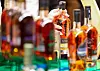Customers shop for limited edition whiskeys at a Hyundai Department Store in Seongnam, Gyeonggi, on Wednesday. The department store opened a whiskey fair ″Whisky Eat″ as the distilled alcoholic beverage gains popularity among young Koreans. The amount of whiskeys sold this year through Monday increased 60 percent on year, announced Hyundai Department Store. [YONHAP]