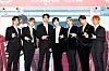 Boy band SuperM poses for photos prior to the online press conference held on Friday morning ahead of the release of its first full-length album 'Super One.' [SM ENTERTAINMENT]
