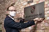 Holger Gerrmann, CEO of Porsche Korea, delivers a nameplate for Porsche Dream Playground in Saesol School in Gimpo on July 22.