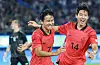 Jeong Woo-yeong, left, celebrates with Lee Han-beom after scoring the second in Korea's 2-1 Asian Games semifinal win over Uzbekistan at HSC Stadium in Hangzhou, China on Wednesday. [YONHAP]