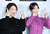 From left, director Bang Woo-ri and actor Kim Yoo-jung pose for photos at a local press event for upcoming Netflix film '20th Century Girl' in Yongsan I'Park Mall branch of CGV in central Seoul on Wednesday. [NEWS1]