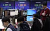 Screens in Hana Bank's trading room in central Seoul show stock and foreign exchange markets open on Thursday. [YONHAP]