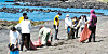 SaveJejuBada Youth club members at Korea International School of Jeju (KISJ) pick up litter at a beach on Jeju Island on April 11. [SJB YOUTH]