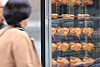 A person walks past a fried chicken stand in Jongno District, central Seoul, on Nov. 9. The number of chicken restaurants stood at 39,789 in 2023, down 4 percent from a year earlier, marking the third consecutive year of decline, according to data from the Korean Statistical Information Service. [YONHAP]