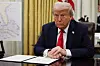 U.S. President Donald Trump prepares to sign an executive order related to the U.S. live entertainment ticketing industry in the Oval Office at the White House in Washington on March 31. [REUTERS/YONHAP]