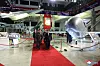 In this photo released by Pyongyang's state-controlled Korean Central News Agency, North Korean leader walks alongside Russian Defense Minister Sergei Shoigu at the Weaponry Exhibition-2023 in Pyongyang on Wednesday. A Hwasong-12 hypersonic guide vehicle is on the left side of the red carpet, while a new drone can be seen on the right. [YONHAP]