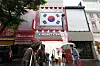 A store in Myeong-dong in central Seoul prepares to open its doors on Aug. 30. [YONHAP]