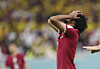 Akram Afif of Qatar reacts during a Group A match between Qatar and Ecuador at the 2022 World Cup at Al-Bayt Stadium in Qatar on Sunday.  [XINHUA/YONHAP]
