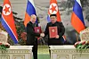 Russian President Vladimir Putin, left, and North Korean leader Kim Jong-un pose for a photo during a signing ceremony of the new partnership in Pyongyang, North Korea on June 19. [NEWS1]