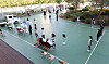 Students at a middle school in Daejeon receive testing for the coronavirus Tuesday on the school’s basketball court after a seventh grader tested positive Monday. [YONHAP]