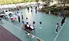 Students at a middle school in Daejeon receive testing for the coronavirus Tuesday on the school’s basketball court after a seventh grader tested positive Monday. [YONHAP]