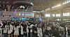 Fans and reporters are seen gathered outside the security check gate while boy band AHOF enters the gate at the Gimpo International Airport in western Seoul on Aug. 8 [SHIN HA-NEE]