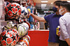 An employee shows different soccer balls to a customer at a department store in downtown Seoul on Tuesday. With the lifting of Covid-19 social distancing regulations and the warming weather, outdoor sports equipment sales have seen a sharp increase. According to Emart, sales of sports goods including items relating to tennis and badminton saw a 40 percent year-on-year increase last month. Soccer goods sales were up 45 percent. Sales of swimsuits, swimming googles and other water-related items surged 117 percent while aquatic sports goods including surfing boards spiked 423 percent. [YONHAP]