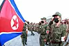 In this photo by the state-run Rodong Sinmun, North Korea soldiers salute the flag. The Korean Central News Agency reported that the country's military would be deployed to ensure a stable and continuous distribution of medicine through pharmacies to combat the country's Covid-19 outbreak. [YONHAP]