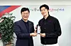 Korean footballer Cho Gue-sung, right, is awarded the Ansan Citizen's Happiness Award by Ansan Mayor Lee Min-Geun at Ansan City Hall in Ansan, Gyeonggi on Monday. Cho, who was born in Ansan, made a name for himself at the 2022 Qatar World Cup where a combination of his achievements on the pitch and his good looks caught the eye of fans around the world. During a game against Ghana, Cho became the first Korean ever to score multiple goals in a World Cup game. [YONHAP]
