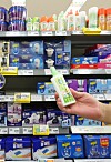 A customer picks up insect repellent at a discount store in Seoul on Monday. According to daily necessities chain Daiso, sales of insect repellent doubled in May compared to a month earlier. Experts predict people will see more insects this summer as a result of unusually warm temperatures last winter. [YONHAP]