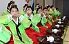 College students in hanbok, or Korean traditional attire, participate in a Coming of Age Day traditional ceremony held at the Daejeon Dong-gu Culture Center in Daejeon on Monday. [NEWS1]