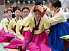 Women participate in an event celebrating Coming of Age Day on Monday at a Confucian academy in Busan. [YONHAP]