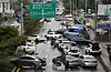 Cars are left abandoned in Seocho District, southern Seoul, on Tuesday after heavy rain on Monday. [NEWS1]