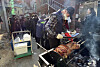 Residents of Daegu’s Buk District hold a barbecue party earlier this month outside an Islamic mosque under construction in the neighborhood. [YONHAP]
