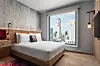 With over 30 brands, Marriott's hotels range from mid-range to luxury, long-stays and home rentals. Shown in the photo is a room in Moxy Bangkok, Thailand. [MARRIOTT INTERNATIONAL]