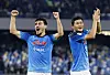 Napoli's Kim Min-jae, right, and Eljif Elmas celebrate after beating Empoli 2-0 in a Serie A game at Stadio Diego Armando Maradona in Naples, Italy on Tuesday. With the win, Napoli have now won 10 straight league games and remain undefeated domestically this season. [REUTERS/YONHAP]