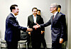President Yoon Suk Yeol, left, greets Apple CEO Tim Cook at their surprise meeting on the margins of the APEC summit in San Francisco on Wednesday. [PRESIDENTIAL OFFICE]