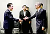 President Yoon Suk Yeol, left, greets Apple CEO Tim Cook at their surprise meeting on the margins of the APEC summit in San Francisco on Wednesday. [PRESIDENTIAL OFFICE]