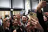 President Yoon Suk Yeol, center, takes selfies with attendees of a meeting with young Korean American scientists and researchers working at a hotel in the San Francisco Wednesday. [JOINT PRESS CORPS]